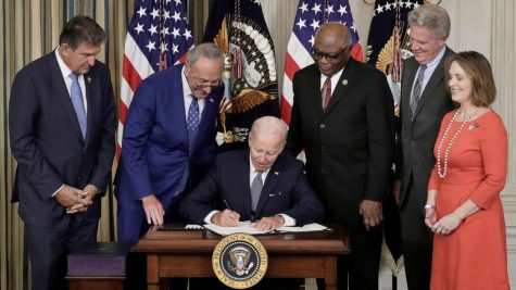 President Joe Biden signs The Inflation Reduction Act with Sen. Joe Manchin, Senate Majority Leader Charles Schumer, House Majority Whip James Clyburn, Rep. Frank Pallone and Rep. Kathy Catsor in the State Dining Room of the White House August 16, 2022 in Washington, D.C. 
