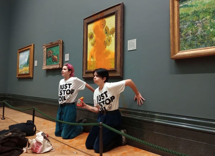 Activists Phoebe Plummer and Anna Holland glued to the London National Gallery wall