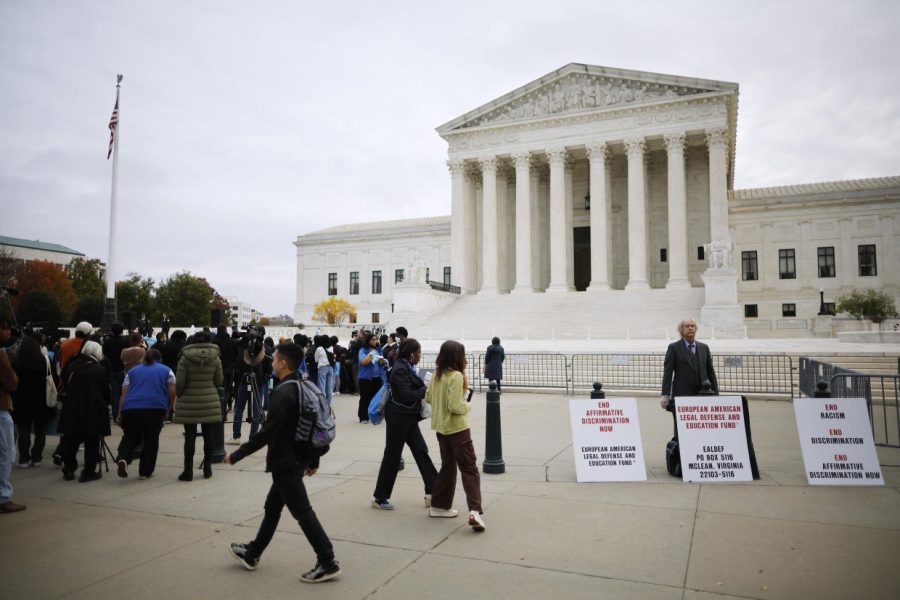 Anti-affirmative action students stand outside the Supreme Court as the justices decide the future of university admissions